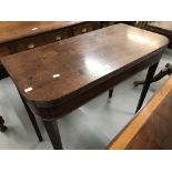 19th cent. Mahogany tea table on tapering supports.