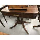 19th cent. Rosewood card table inlaid with ebony and decorated with a single brass moulding to the