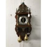 Clocks: 20th cent. Treen and brass ware Dutch striking wall clock. 24ins. x 10ins.
