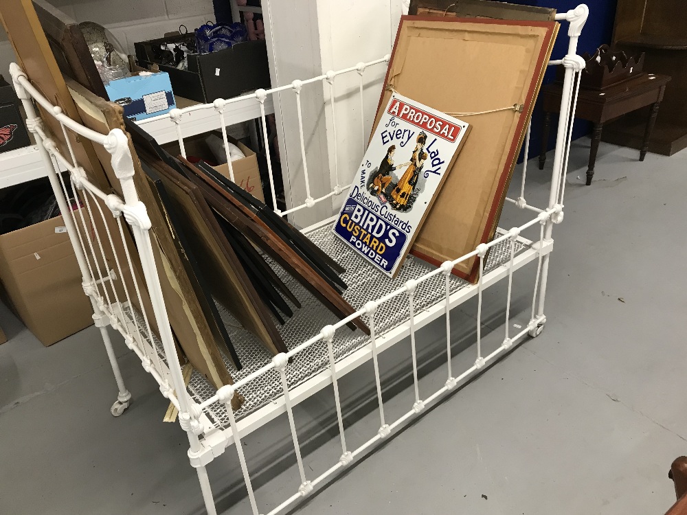 19th cent. Painted cast iron child's cot that converts to a bed. 50ins. x 29ins. x43ins.