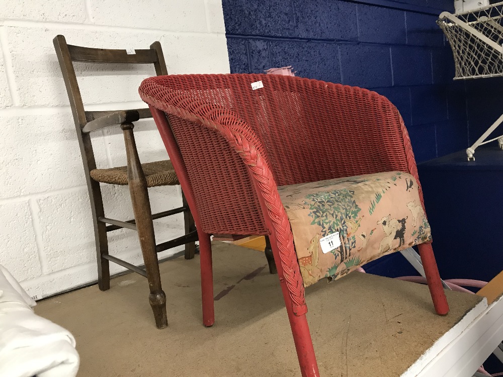 Unusual Lloyd loom Lusties child's chair in red with period music book beneath the seat. Plus one