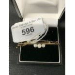 Hallmarked Gold: 9ct. bat brooch 44.5mm, set with three cultured pearls, one at 4mm and two at 3.