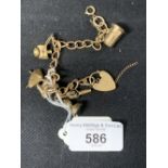 Hallmarked Gold: 9ct. bracelet, 6 charms attached. London. 17.2g