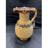 Late 19th early 20th cent. salt glaze Doulton puzzle jug, buff glazed body decorated with a drinking