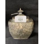 Hallmarked Silver tea caddy with hinged cover, embossed with leaf and floral decoration.