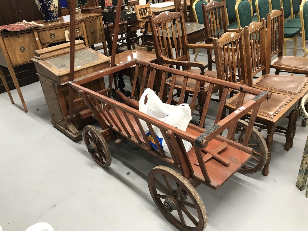 20th cent. Pine dog drawn dog cart, with iron rimmed wheels, used in the past mainly for