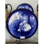 20th cent. Ceramics: Royal Doulton flue blue 'Babes in the Wood' plaque - a pair 7¼ins. Possibly