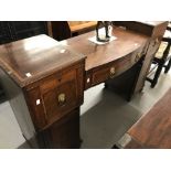 Early 19th cent. Double pedestal mahogany sideboard with bow front central section, brass lion