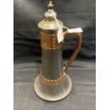 Lambeth Doulton: Silicon ware tapering jug and cover, made to resemble stitched leather jack with