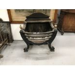 19th cent. Cast iron fire basket in neo classical style.