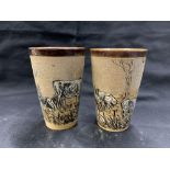 Doulton Lambeth: Beakers by Hannah Barlow incised with grazing cattle, brown glazed border. The