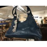 Fashion: Radley light blue leather handbag, cream lining with blue border, zip compartment, Dog logo