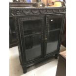 19th cent. Heavily carved Chinoiserie style bookcase with glazed doors. 45½ins. x 36ins. x 12½ins.