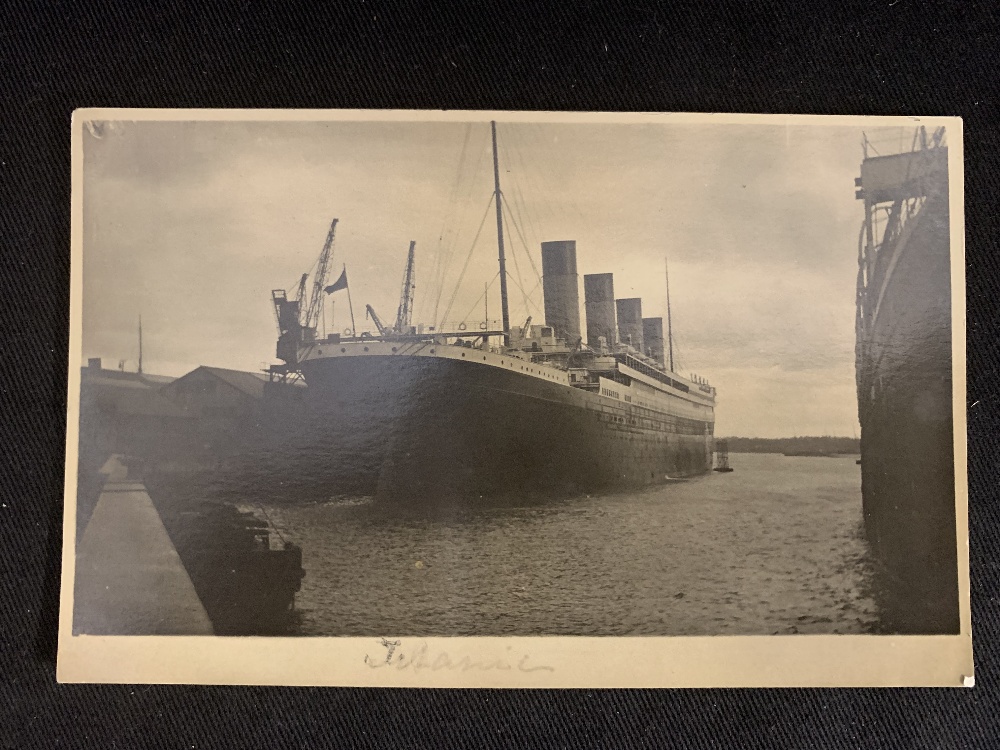 R.M.S. TITANIC: Extremely rare real photo postcard produced privately showing Titanic from the stern