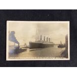 R.M.S. TITANIC: GD Courtney real photo card of Titanic leaving Southampton. Postally used in