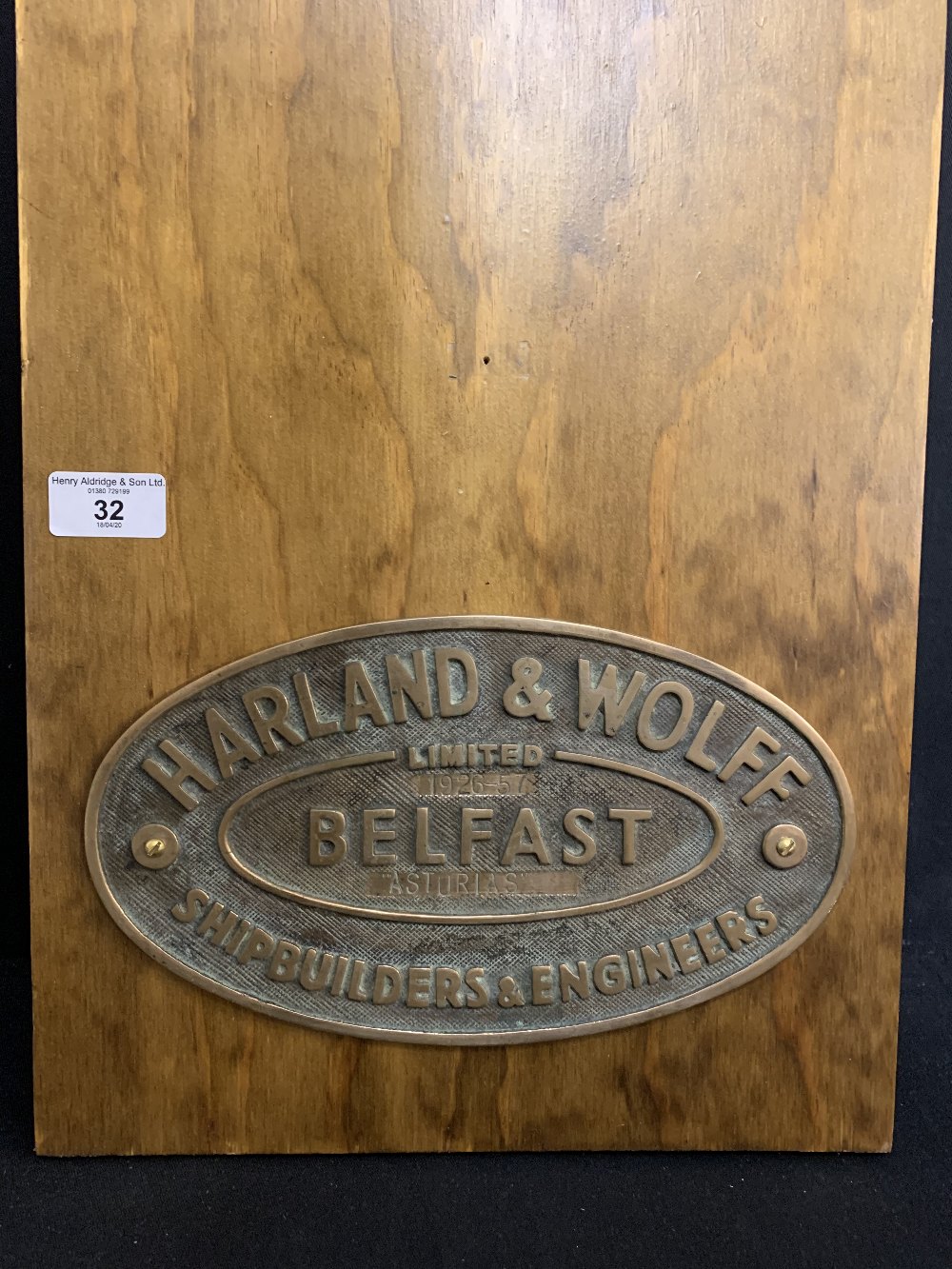 HARLAND AND WOLFF: Cast oval builder's plaque 'Belfast Shipbuilding'. 10ins. Stamped 'Asturias.' NB: