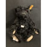 R.M.S. TITANIC: Steiff black replica of 1912 mourning bear, without box. 12ins.