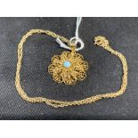 Hallmarked Jewellery: 9ct. Gold rope link chain with a floral pendant attached set with a single