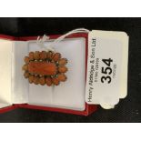 Jewellery: 18ct. Tested carved coral cluster ring, size P. 30 and 19mm. 6g.