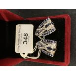 Jewellery: 18ct. Tested pair of Diamond Sapphire Double clips. Diamond weight approx 3ct. Sapphire