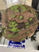 Militaria: WWII pattern German Steel Helmet with a zimmerit camouflage painted finish, together with