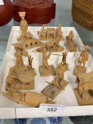 20th cent. Oriental treen figures depicting people carrying out everyday tasks. (12).