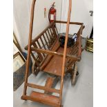 20th cent. Pine dog drawn dog cart, with iron rimmed wheels, used in the past mainly for