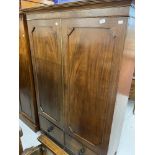 20th cent. Mahogany two door over two drawer wardrobe. 42½ins. x 18ins. x 69ins.