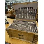 20th cent. Oak canteen with fitted lid and two drawers, contains 100 pieces of flatware, eight of