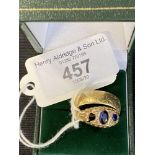 Hallmarked Gold: 18ct wedding band sapphire set ring, three stones, one missing. 9.2g.