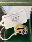 Hallmarked Gold: 18ct wedding band sapphire set ring, three stones, one missing. 9.2g.