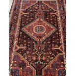 Carpets & Rugs: 20th cent. Persian/Hamadan carpet. Red ground, central medallion, decorated with