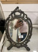 Early 20th cent. White metal shield shaped toilet mirror. Height 15ins.