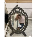 Early 20th cent. White metal shield shaped toilet mirror. Height 15ins.