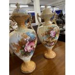 Early 20th cent. Mantel vases in the form of two handled urns, with covers, transfer decoration of