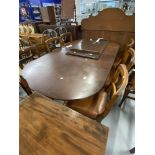 19th cent. Oval extending dining table with one leaf and a set of 6 Maple & Co bar back dining