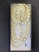 Jewellery: Triple row necklet of graduated simulated pearls, plus bracelet also of simulated