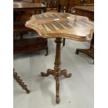 19th cent. Walnut inlaid Backgammon table of serpentine form, twisted central column of tripod base.