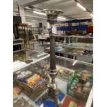 19th/20th cent. Plated torchere, central column, support by tripod base with lion paws and depicting
