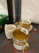 19th cent. Ceramics: Royal Worcester coffee cup and saucer, ivory ground decorated with embossed