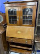 Edwardian Mahogany bureau bookcase with galleried top, leaded glazed doors, and bronze drop handles.