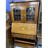 Edwardian Mahogany bureau bookcase with galleried top, leaded glazed doors, and bronze drop handles.