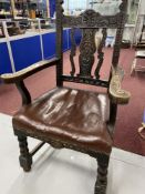 19th cent. Oak carver chair with bobbin turned front supports and red leather seat.