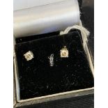 Diamond solitaire earrings each set in white gold, test 18ct, 0.40 the pair weight inclusive 1g.