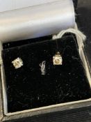 Diamond solitaire earrings each set in white gold, test 18ct, 0.40 the pair weight inclusive 1g.