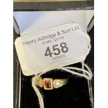 Gold Jewellery: Stamped 18ct ring set with two old cut diamonds 0.20ct total with a central