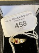 Gold Jewellery: Stamped 18ct ring set with two old cut diamonds 0.20ct total with a central