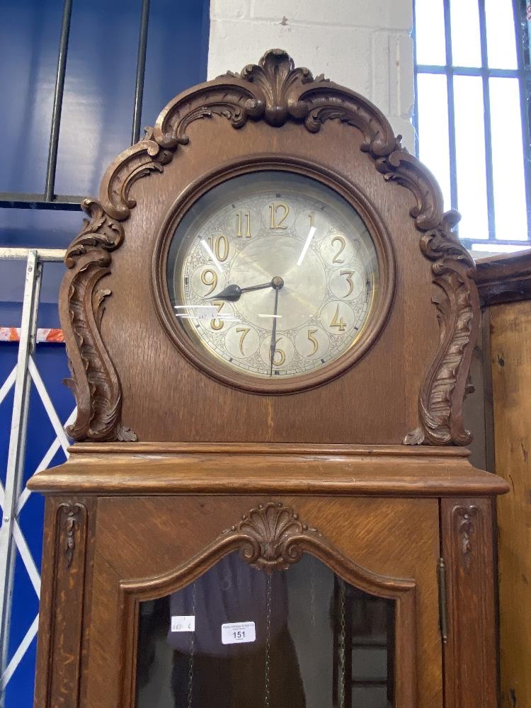 Clocks: Late 19th/early 20th cent. German oak three chain longcase clock. 11ins silvered dial with