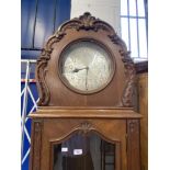 Clocks: Late 19th/early 20th cent. German oak three chain longcase clock. 11ins silvered dial with