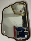 20th cent. Oak framed bevel edge mirror, waterfall shaped. 29¾ins. x 19¾ins.